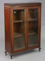 An Edwardian mahogany small china display cabinet fitted two shelves enclosed by a pair of glazed
