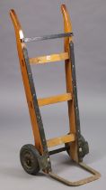 A pair of wooden & iron sack trucks, 108cm high.