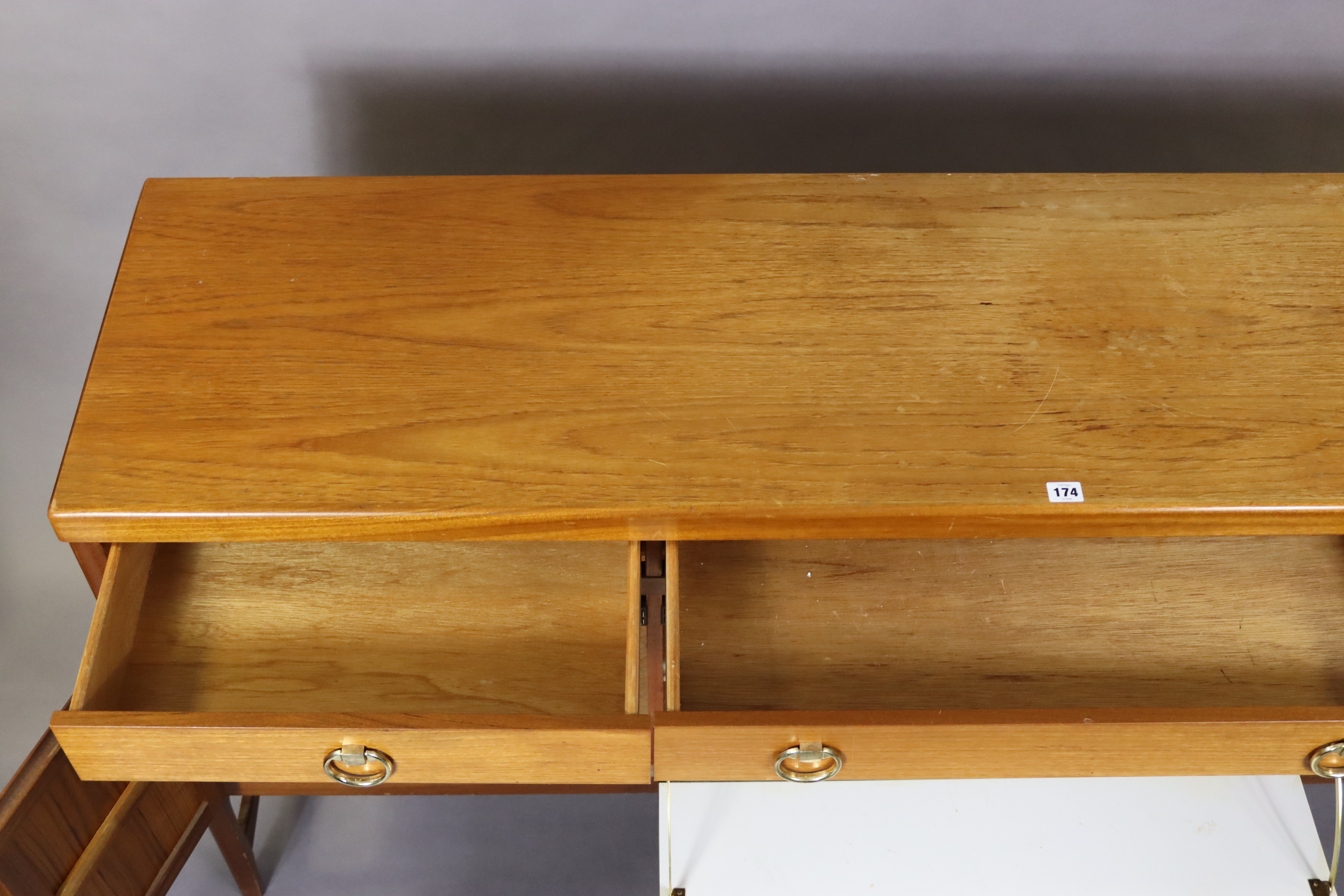 A Nathan teak sideboard fitted three frieze drawers above cupboards enclosed by a fall-front panel - Image 4 of 7