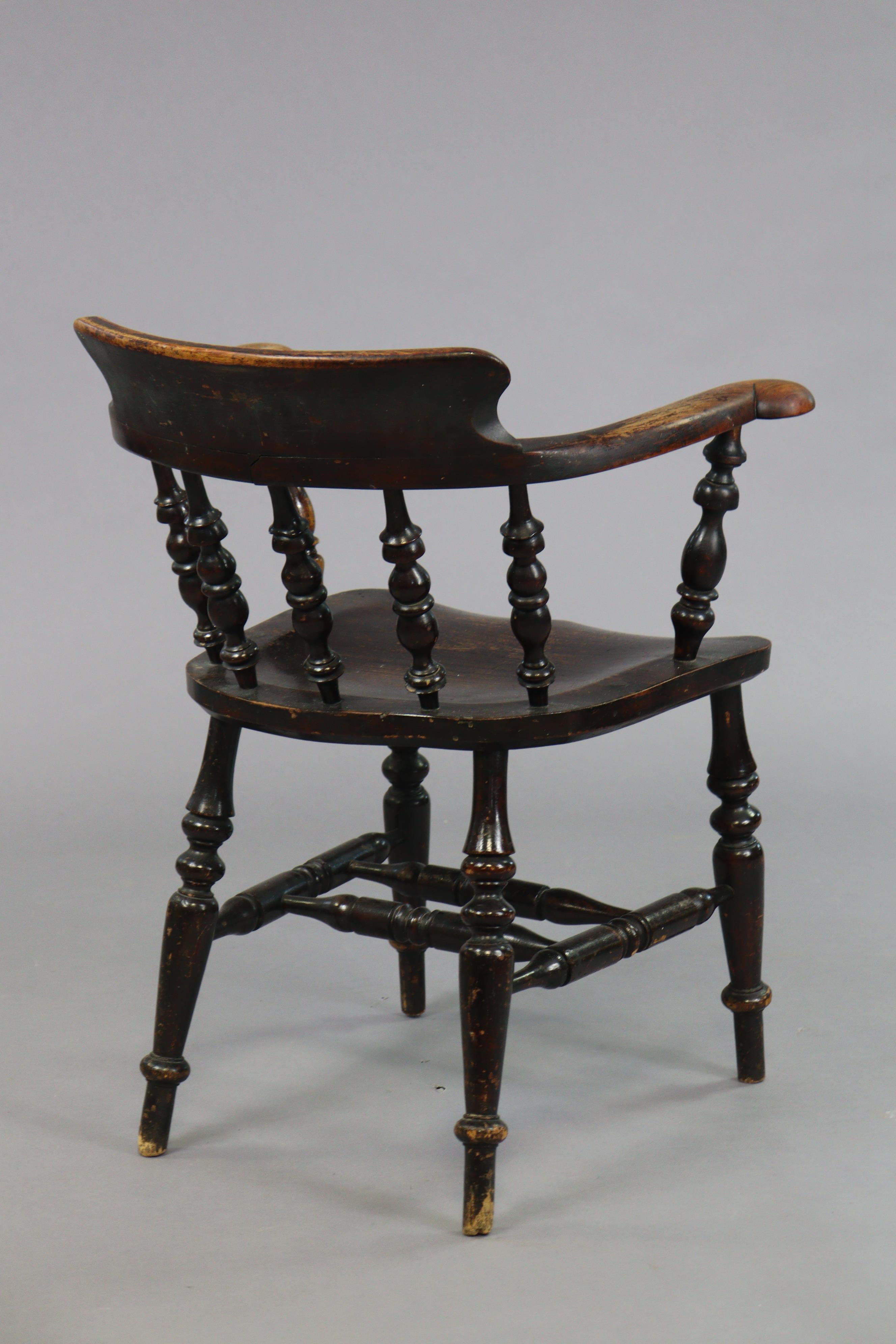 A spindle-back captain’s chair with a hard seat, & on four turned legs with spindle stretchers. - Image 4 of 5