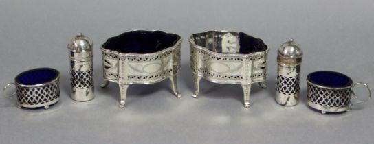 A pair of Edwardian silver salt cellars in the late 18th century style, of serpentine outline,
