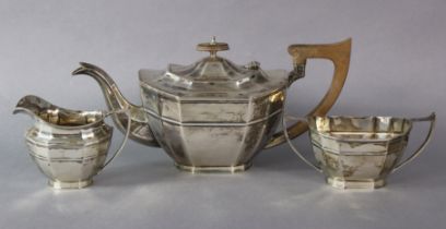 A George V silver three-piece tea service of shaped oblong form; Sheffield 1932, by Cooper