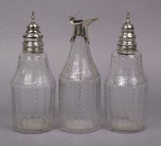 Three matching late 18th/early 19th century cut glass condiment bottles with silver mounts, 17.5cm