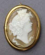 A Victorian carved shell oval cameo brooch/pendant depicting a Bacchanalian bust, in un-marked