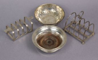 An Edwardian silver four division toast rack, 8.5cm wide, London 1901; another Sheffield 1939; a