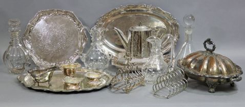 Various silver-plated items, a pair of cut-glass carafes, and two glass decanters.