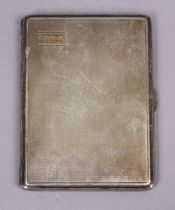 A George V silver engine-turned rectangular pocket cigarette case, 11.5cm x 8.5cm; Birmingham