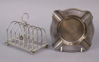 A Victorian silver six-division toast rack on ball feet, 11cm wide, London 1895, by W. S.