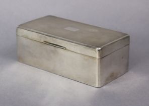 A George V silver rectangular cigarette box with engine-turned hinged lid & wood lined interior,