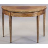 A late 18th century mahogany & satinwood crossbanded card table with demi-lune fold-over top (