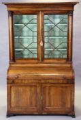 An early/mid-19th century rosewood bureau bookcase fitted three shelves enclosed by a pair of