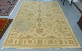 A Caucasian carpet, decorated with foliage designs, on a cream/beige coloured ground  78" x 114"