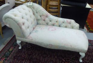 A child's modern Edwardian style nursery chaise longue, decorated in floral patterned, white and