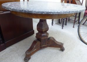 A mid Victorian mahogany pedestal centre table with an inset marble top  28"h  31"dia