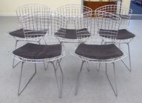 A set of five Bertoia design chromium plated chairs with charcoal coloured, fabric covered cushion