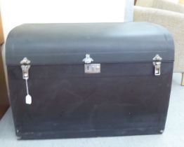 A Vintage Brooks ebonised car trunk (unfitted) with straight sides and a hinged lid, on a plinth