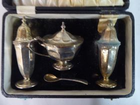 A four piece silver condiments set  boxed  Sheffield 1951