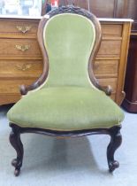 A late Victorian mahogany showwood framed spoonback chair, upholstered in braided green fabric,