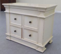 A modern shabby chic painted inverted breakfront, four drawer cabinet, on a plinth  24"h  29"w