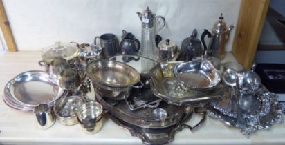 Silver plated and pewter tableware: to include a claret jug; tureens; and serving trays  various