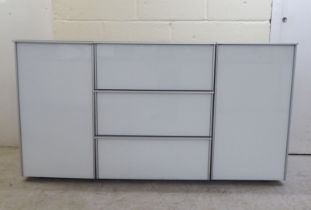 A modern white and grey laminate and satin silver coloured metal mounted sideboard, comprising a