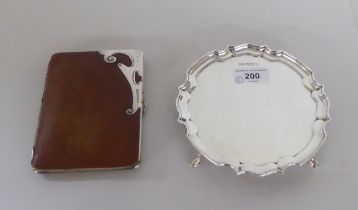 A Georgian design silver waiter  5"dia; and a white metal mounted hide wallet  mixed marks