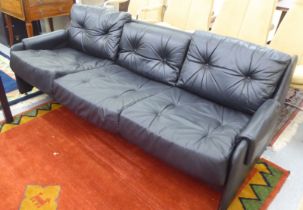 A modern Pirelli moulded stitched black hide upholstered three person low back settee with