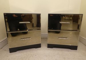 A pair of modern mirrored two drawer bedside cabinets, raised on bracket feet  21"h  18"w