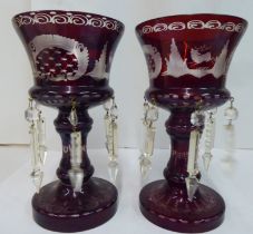 A pair of late 19thC ruby coloured glass and engraved goblet design lustre vases, the bowls