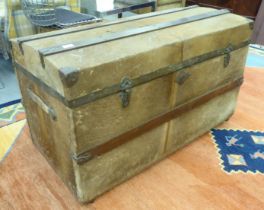 A vintage fur covered and brass mounted trunk with straight sides and domed lid, on a plinth  22"