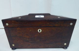 A Regency rosewood tea casket of sarcophagus form with a hinged lid, enclosing two lidded