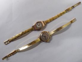 Two ladies 9ct gold cased wristwatches, both faced by Arabic dials, on rolled gold straps