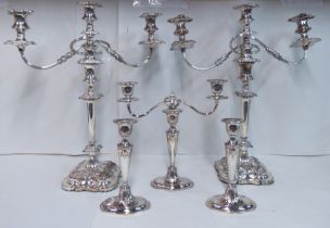 A pair of 20thC Victorian style, silver plated, twin branch candelabra  20"h  15"w; another 10"h;