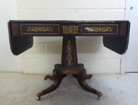 A Regency brass inlaid rosewood sofa table with two frieze drawers, raised on a column and splayed