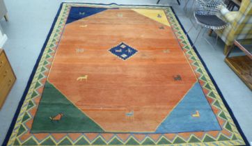 A modern woollen rug, decorated with animals on a two-tone orange/red ground  102" x 118"