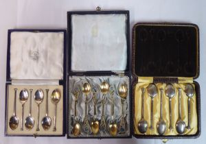 Three boxed sets of six silver/white metal teaspoons  mixed marks