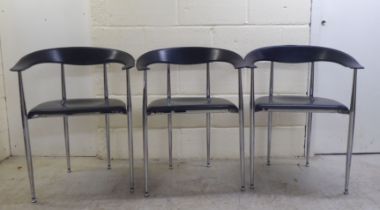 A set of three modern Arper, Italy stainless steel framed dining chairs with moulded and stitched