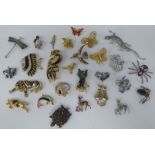Costume jewellery, comprising assorted floral brooches in white and yellow metal, some set with