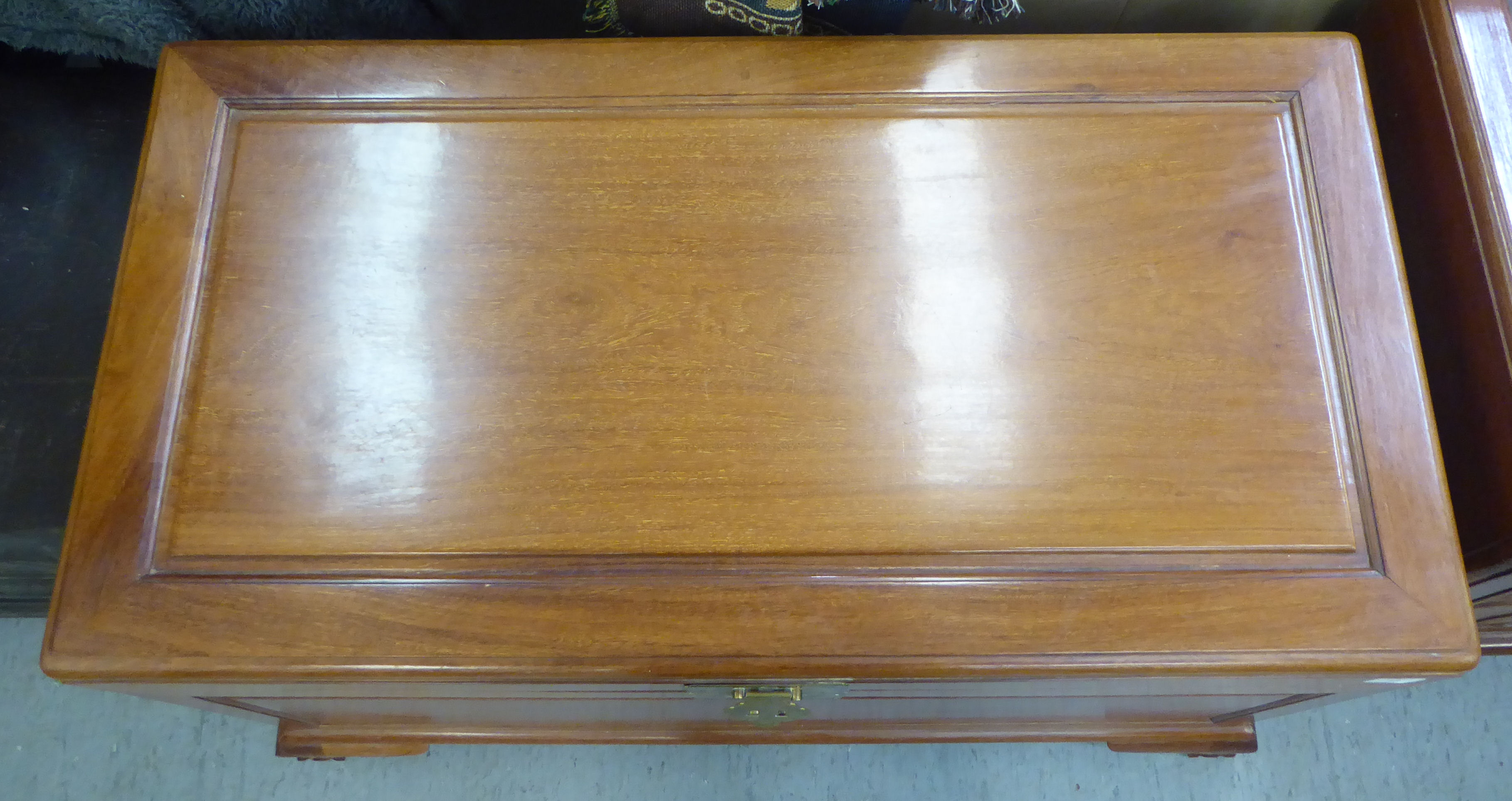 A mid 20thC Chinese fruitwood chest with a hinged lid, raised on cabriole legs  23"h  40"w - Image 2 of 3