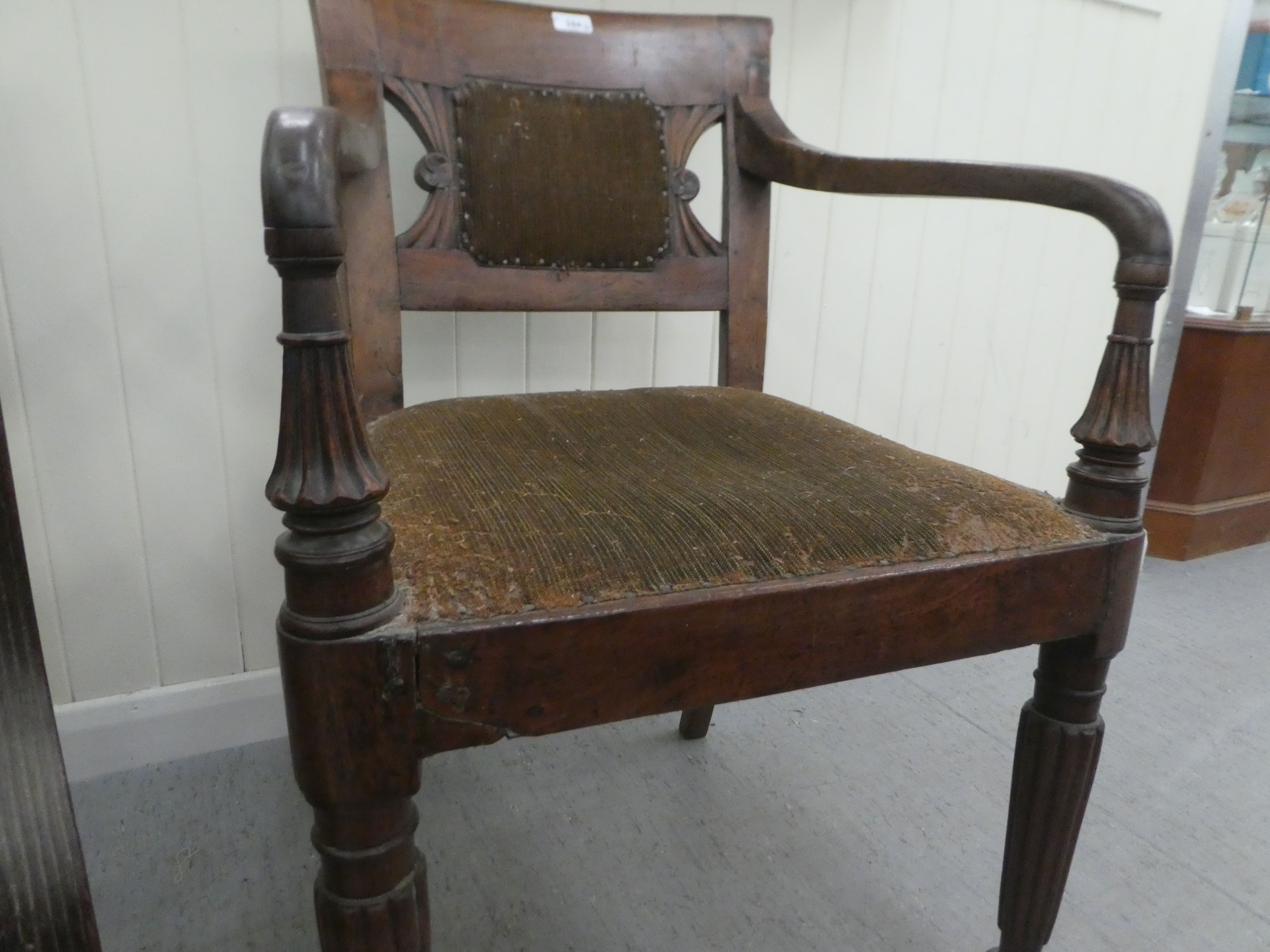 A Regency mahogany framed dining chair with a bar back and swept open arms, raised on turned, reeded - Image 4 of 4