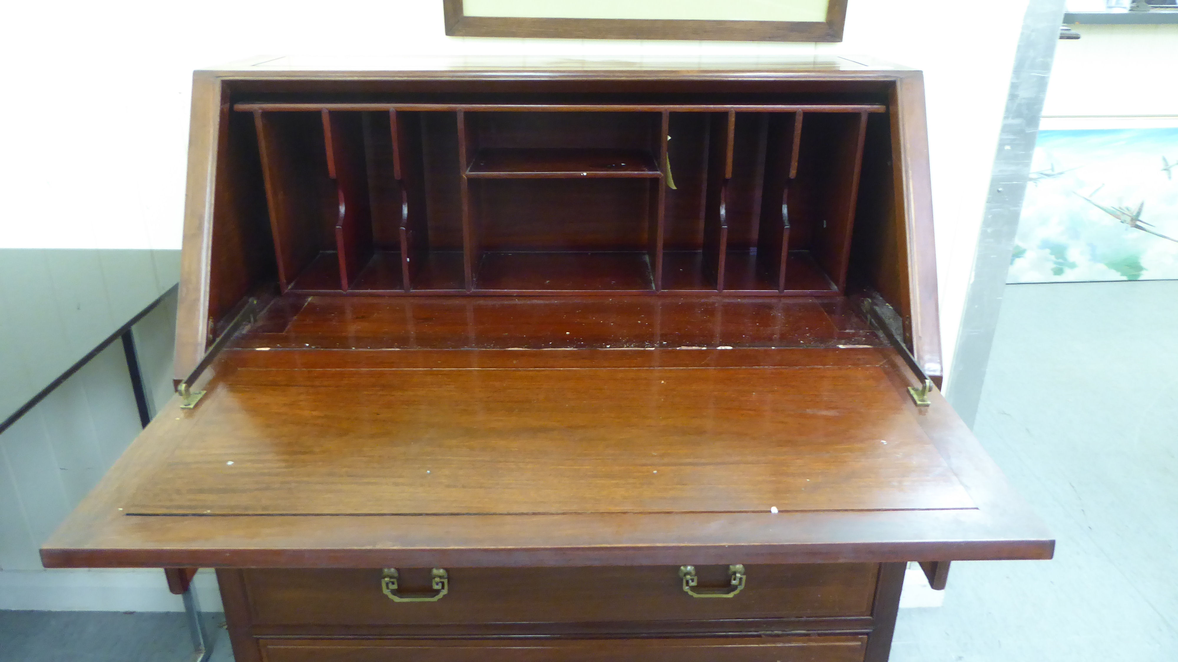 A modern Chinese fruitwood bureau with a fall flap, over two short/two long drawers, raised on block - Image 2 of 4