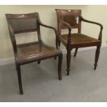 A Regency mahogany framed dining chair with a bar back and swept open arms, raised on turned, reeded