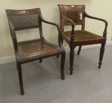 A Regency mahogany framed dining chair with a bar back and swept open arms, raised on turned, reeded