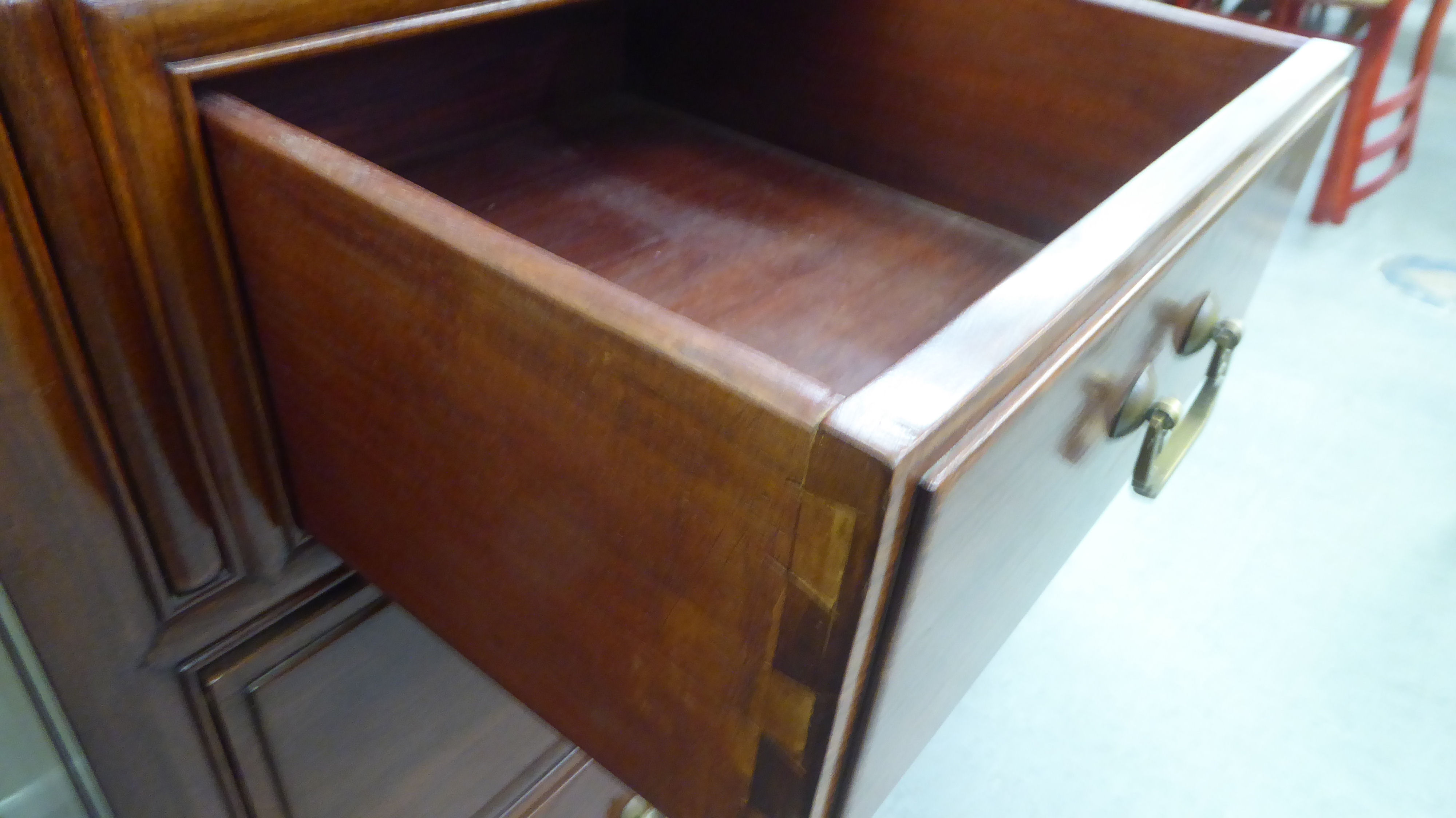 A modern Chinese fruitwood bureau with a fall flap, over two short/two long drawers, raised on block - Image 3 of 4