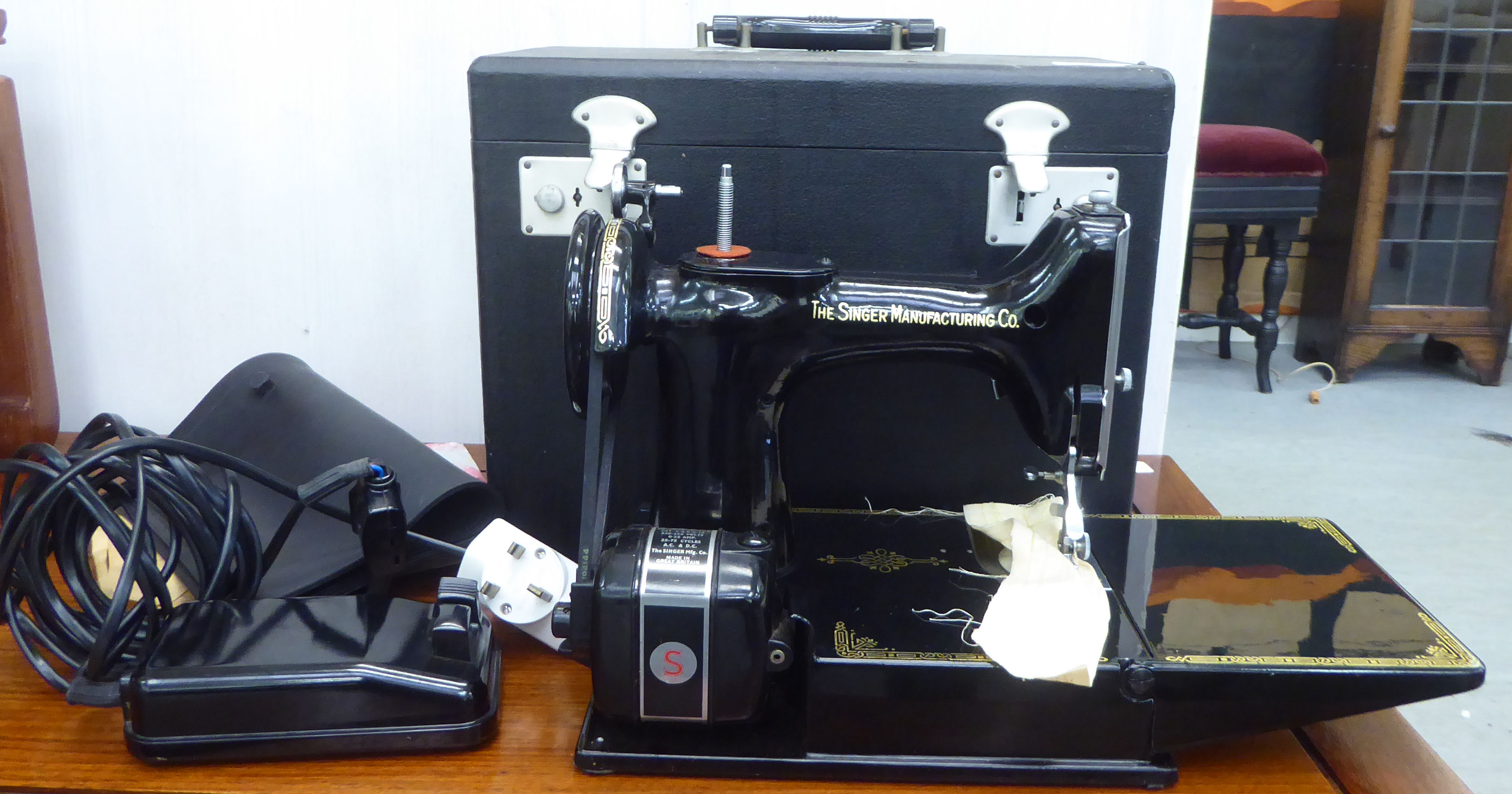 A Singer electric sewing machine  cased