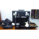 A Singer electric sewing machine  cased