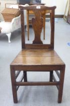 A George III ash and oak framed hall chair with a solid seat, raised on square, tapered legs