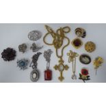 Costume jewellery, mainly brooches and pendants of various design