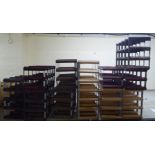Seven wooden and metal wine racks  largest with provision for 24 bottles  25" x 17"
