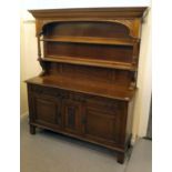 A modern Victorian design oak dresser with two open shelves, over two drawers and two panelled